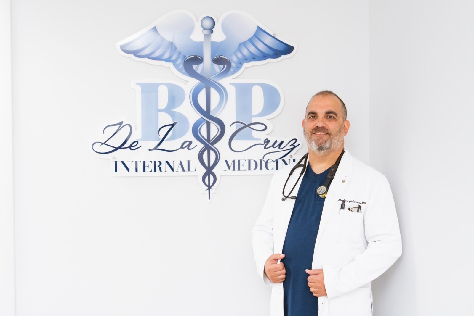 Dr. Blas Perez De La Cruz standing in his Internal Medicine office