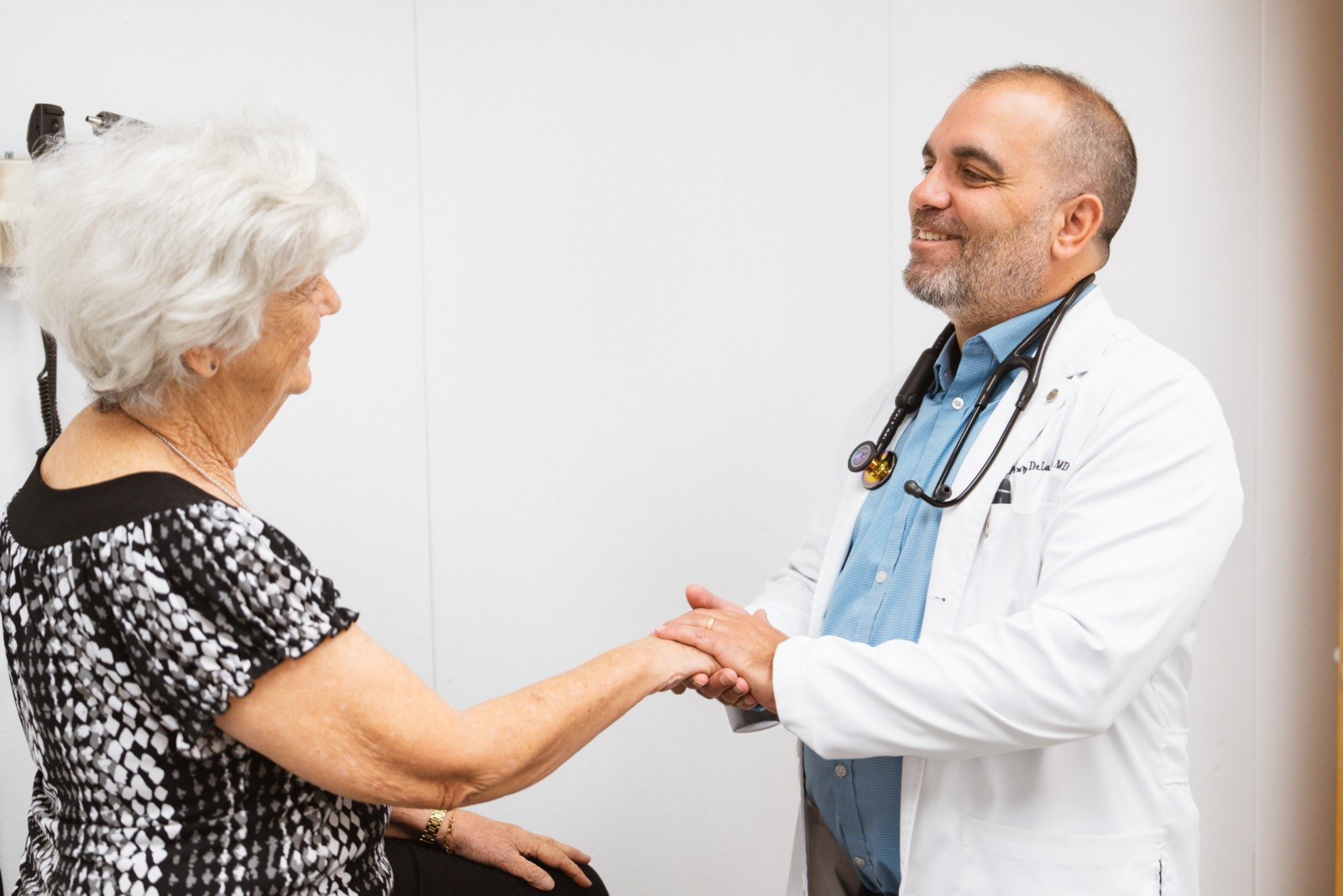 Dr. Blas Perez De La Cruz speaking warmly with a patient